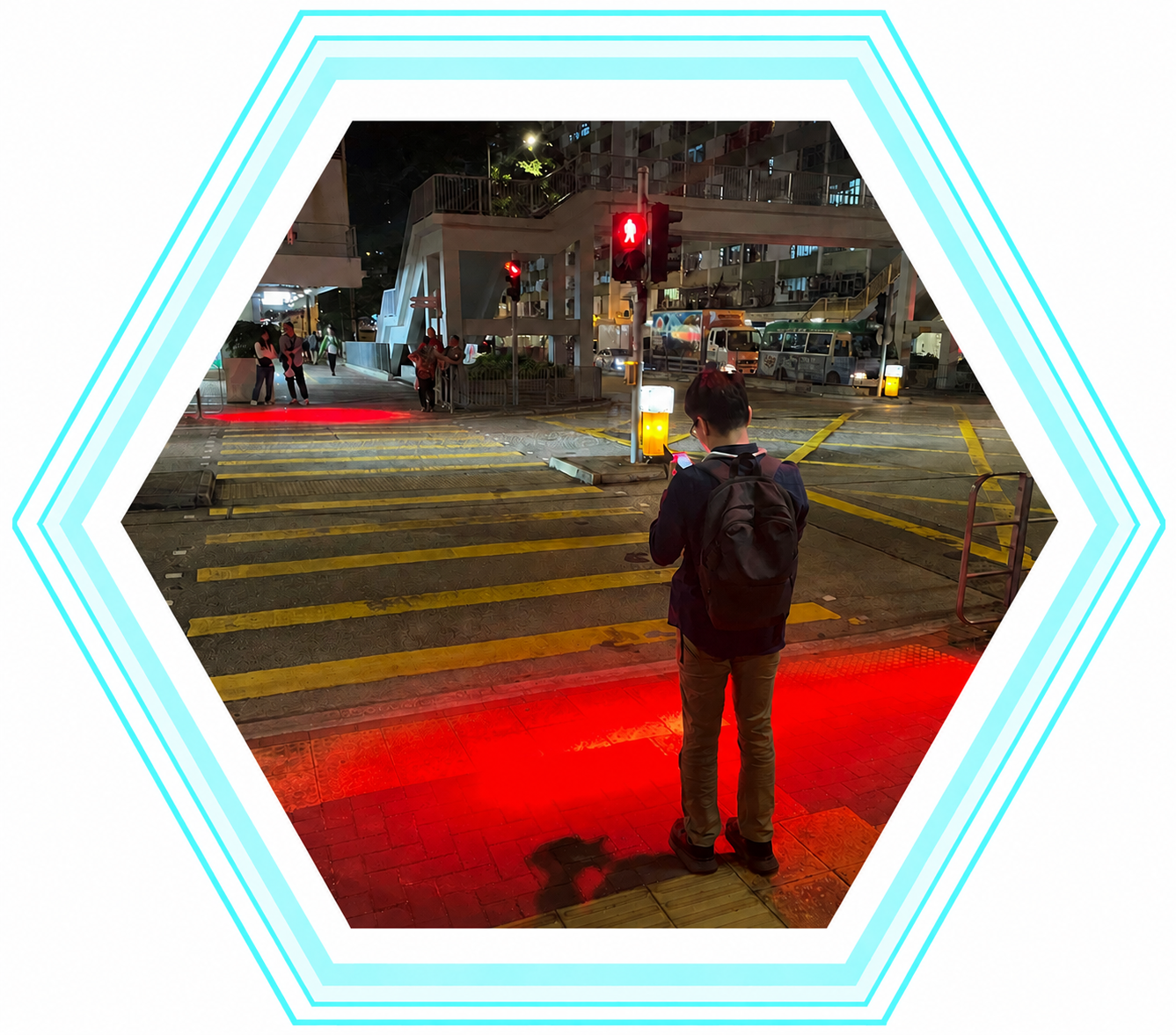 Pedestrian waiting at a signal-controlled crossing